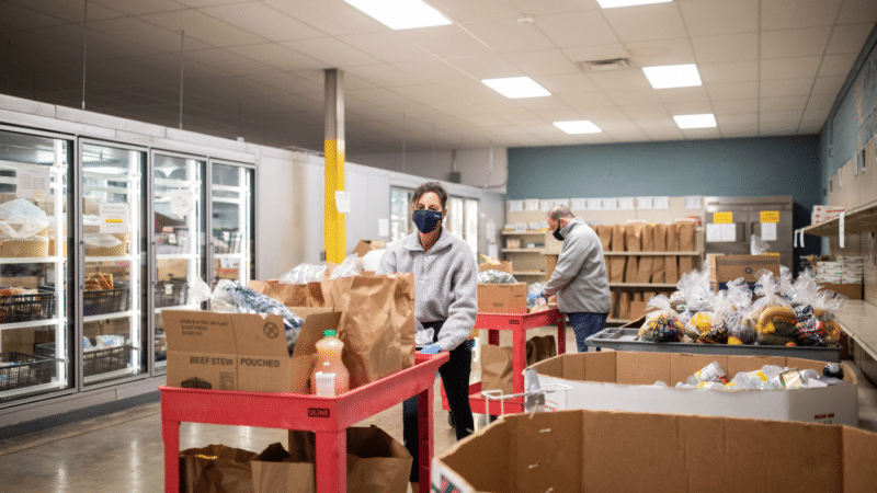 Volunteers at Harvey Kornblum food pantry gather groceries for people in need