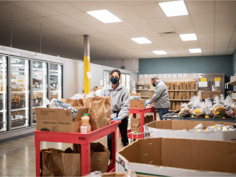 Volunteers at Harvey Kornblum food pantry gather groceries for people in need